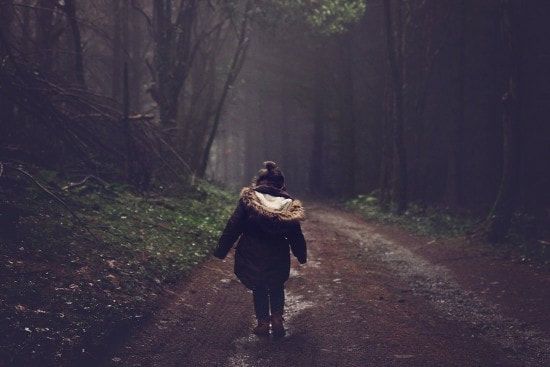 girl walking in forest